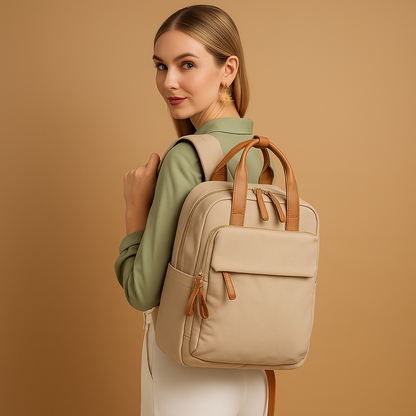 Water-repellent laptop backpack for women with padded 14-inch laptop sleeve, travel trolley sleeve, and stylish lightweight design.