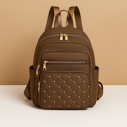 Water-resistant women’s backpack with anti-theft back pocket, adjustable straps, and spacious compartments, perfect for travel or everyday use.