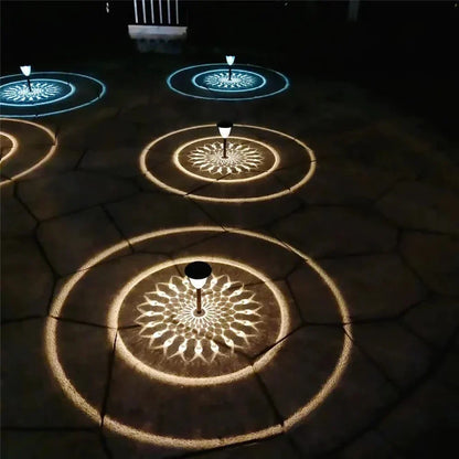 Weatherproof garden light casting intricate mandala shadows, solar-powered, LED, IP65 waterproof, enhances outdoor decor.