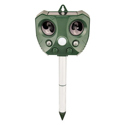"Weatherproof solar ultrasonic animal repeller in garden, motion-activated to deter pests like cats and rodents."
