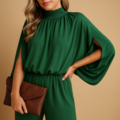 Women’s green wide-leg jumpsuit with long sleeves and relaxed fit, perfect for casual looks or formal occasions.