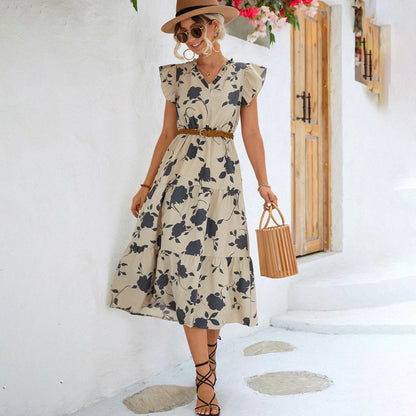 "Women's black midi dress with V-neck, floral print, side view"