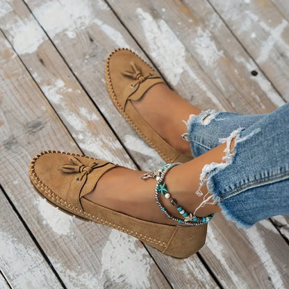 "Women's classic bow loafers in soft suede, stylish flat slip-ons with elegant bow accent, ideal for any occasion."