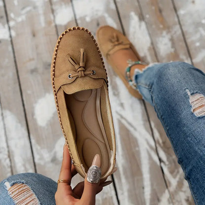 "Women's classic bow loafers in soft suede, stylish flat slip-ons with elegant bow accent, ideal for any occasion."