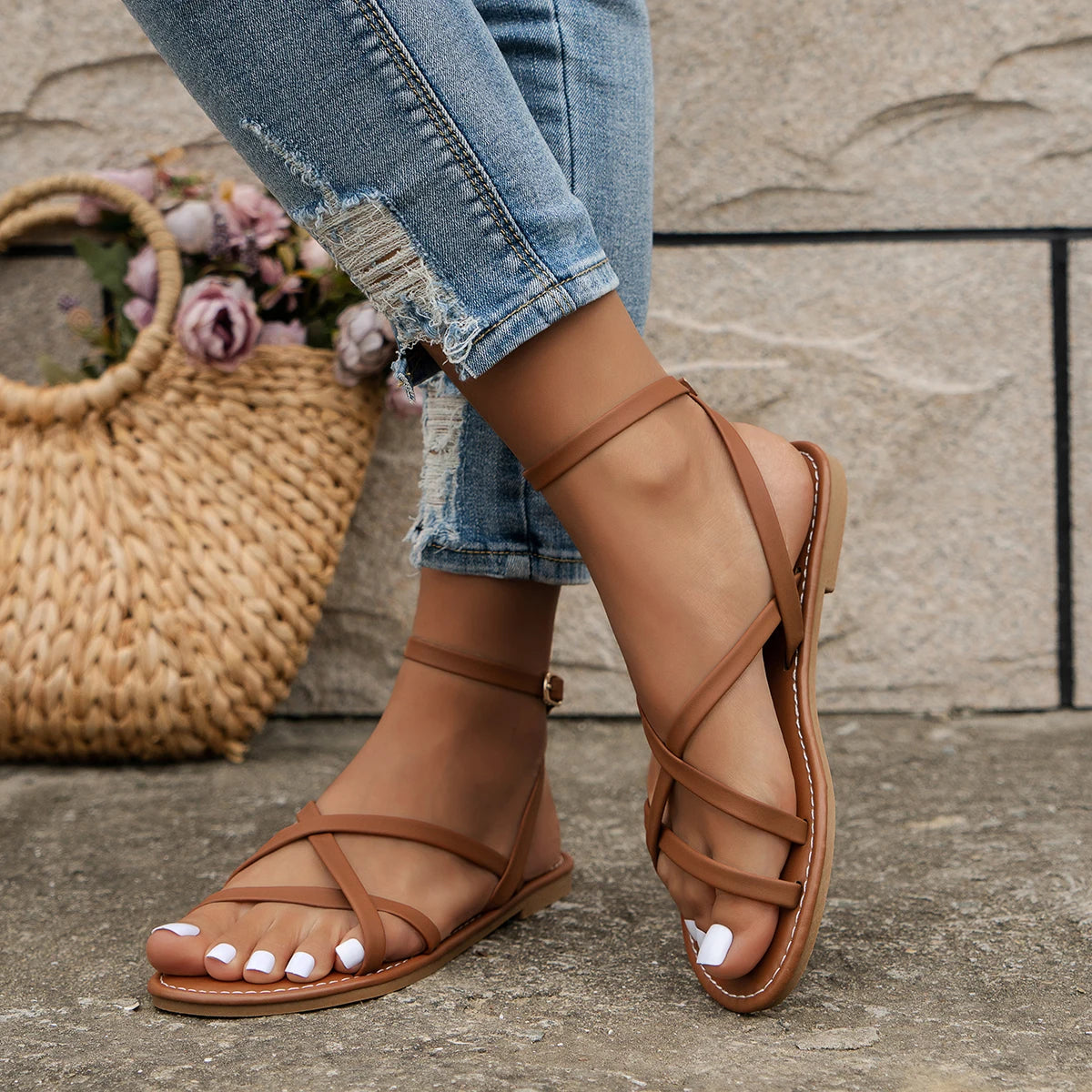 Women's criss-cross strap flat sandals with open-toe, side view, sleek design, perfect for summer outings.