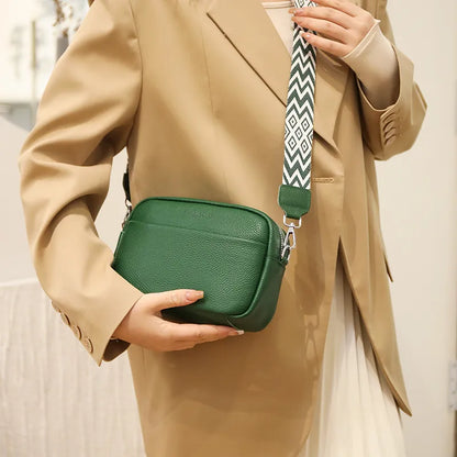 "Women's elegant beige leather crossbody bag with pebbled texture and adjustable strap, perfect for versatile fashion styling