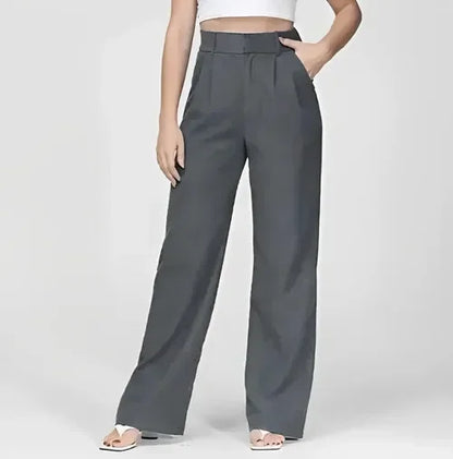 "Women's high-waist wide-leg trousers with pleated front, tailored fit, and soft wool blend for elegant and sophisticated sty