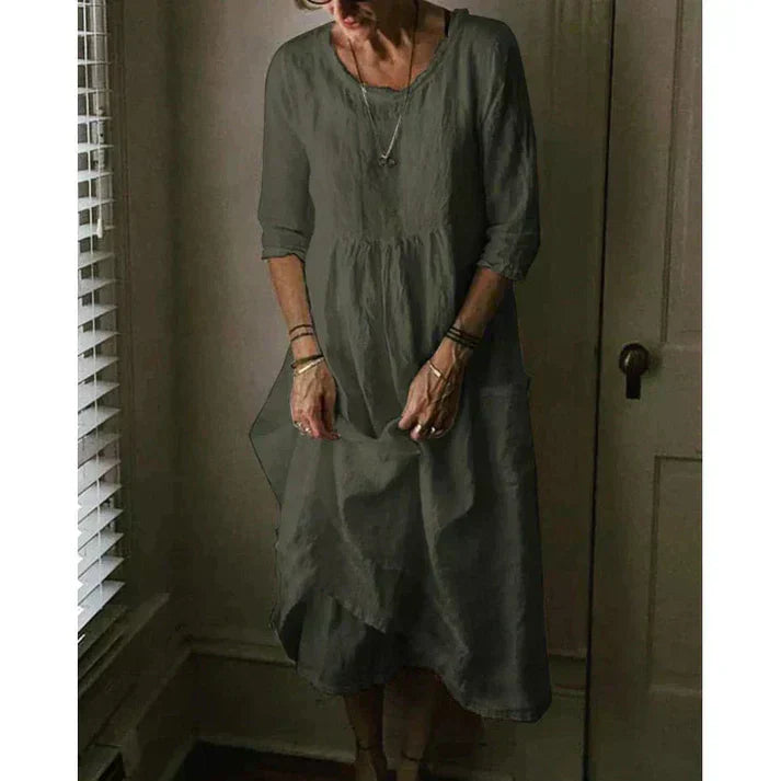 "Women's Loose Fit Cotton Linen Midi Dress with round neck, 3/4 sleeves, asymmetric hem, and pockets in various colors."