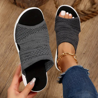 "Women's orthopedic open-toe knit sandals with contoured sole, stretch-knit upper, and slip-on design for comfort and style."