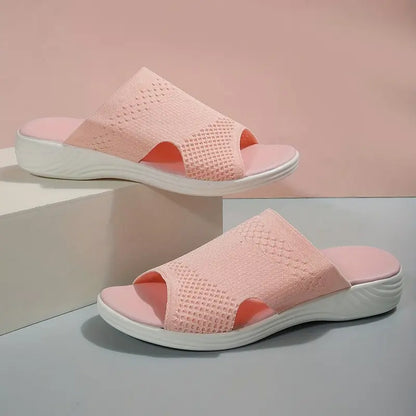 "Women's orthopedic open-toe knit sandals with contoured sole, stretch-knit upper, and slip-on design for comfort and style."