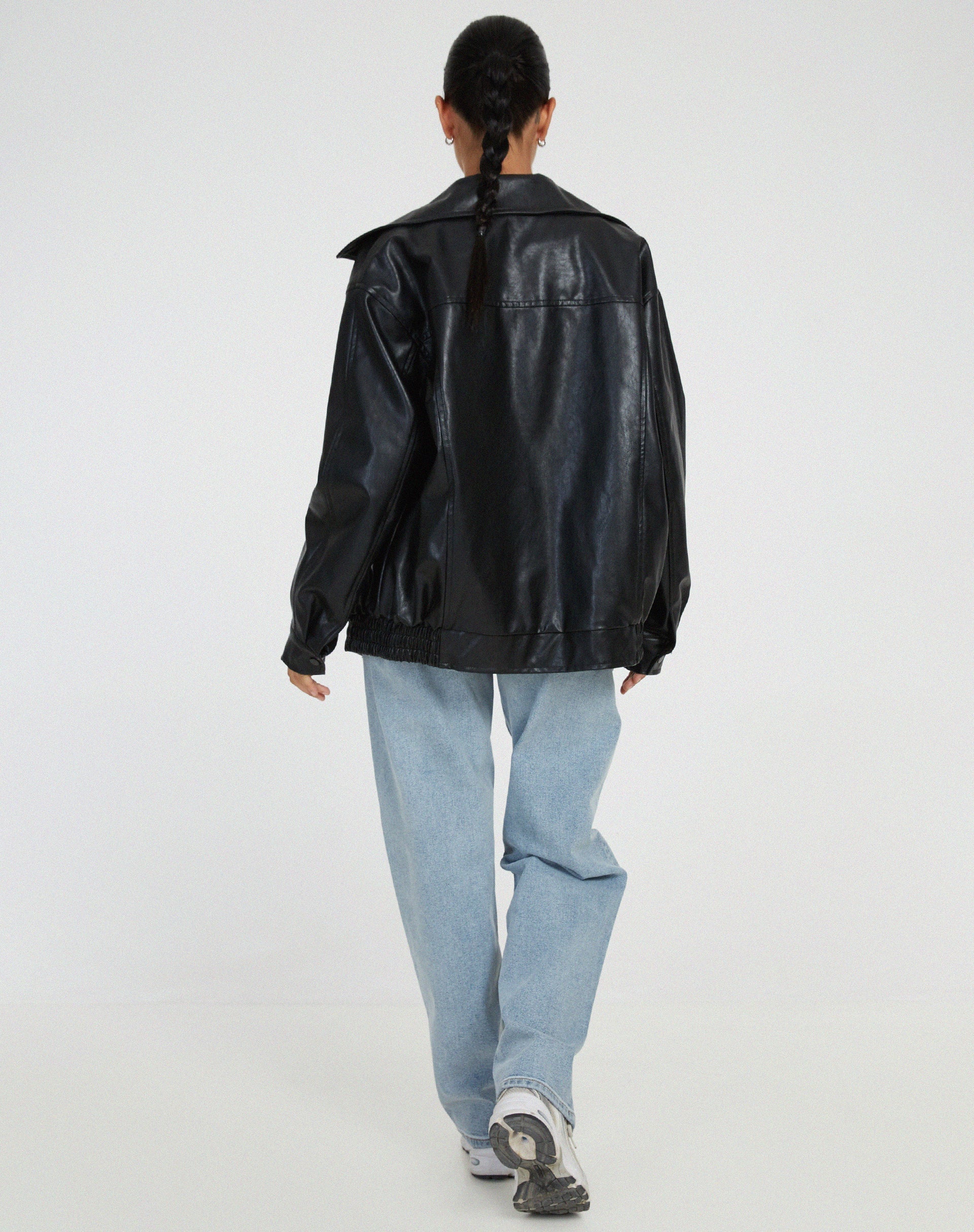 Women's oversized leather jacket in chocolate brown; luxurious, modern, and versatile with stylish front pockets.