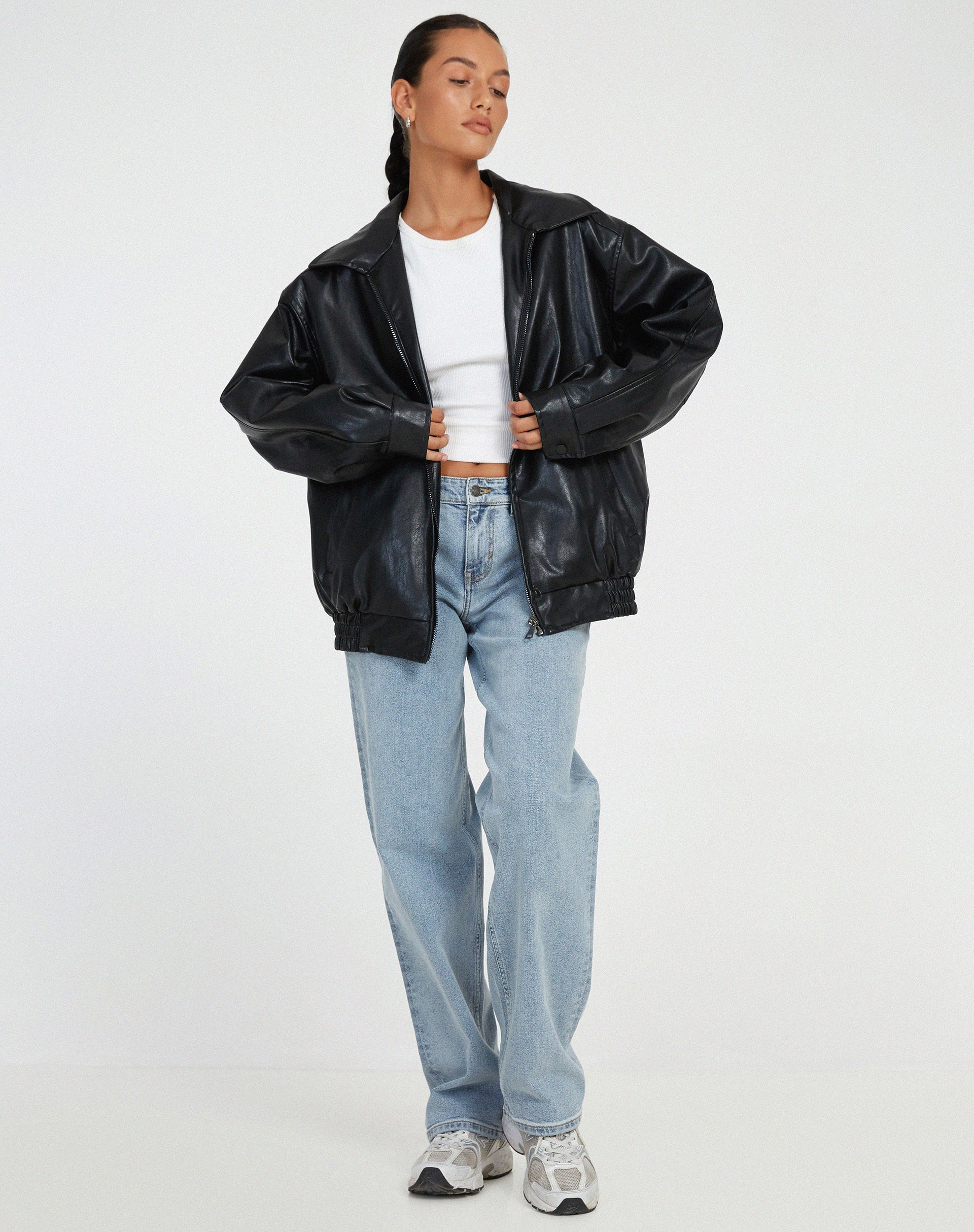 Women's oversized leather jacket in chocolate brown; luxurious, modern, and versatile with stylish front pockets.