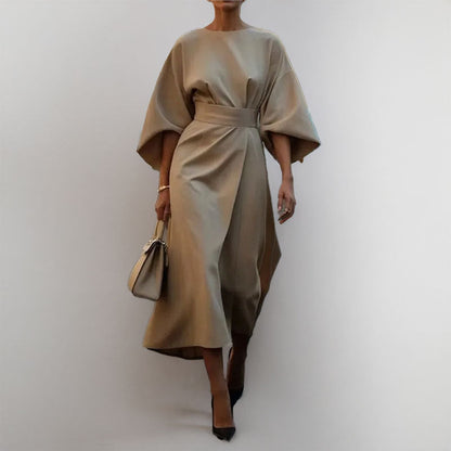 Women's satin batwing maxi dress, elegant draped silhouette, fitted waist, flowing skirt, perfect for formal occasions.