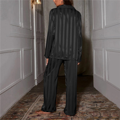 "Women's silk-feel pyjama set, front view: luxurious loungewear with button-down top, matching trousers, elegant sheen."