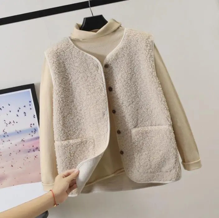 "Women's stylish fleece vest, front view, showing textured design, sleeveless, perfect for winter warmth and elegant style."