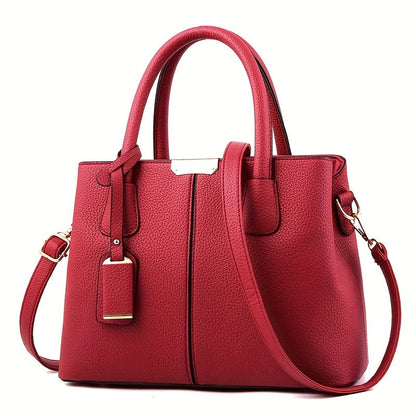 Women's stylish leather handbag with tote design, detachable crossbody strap, gold accents, spacious interior, elegant look.