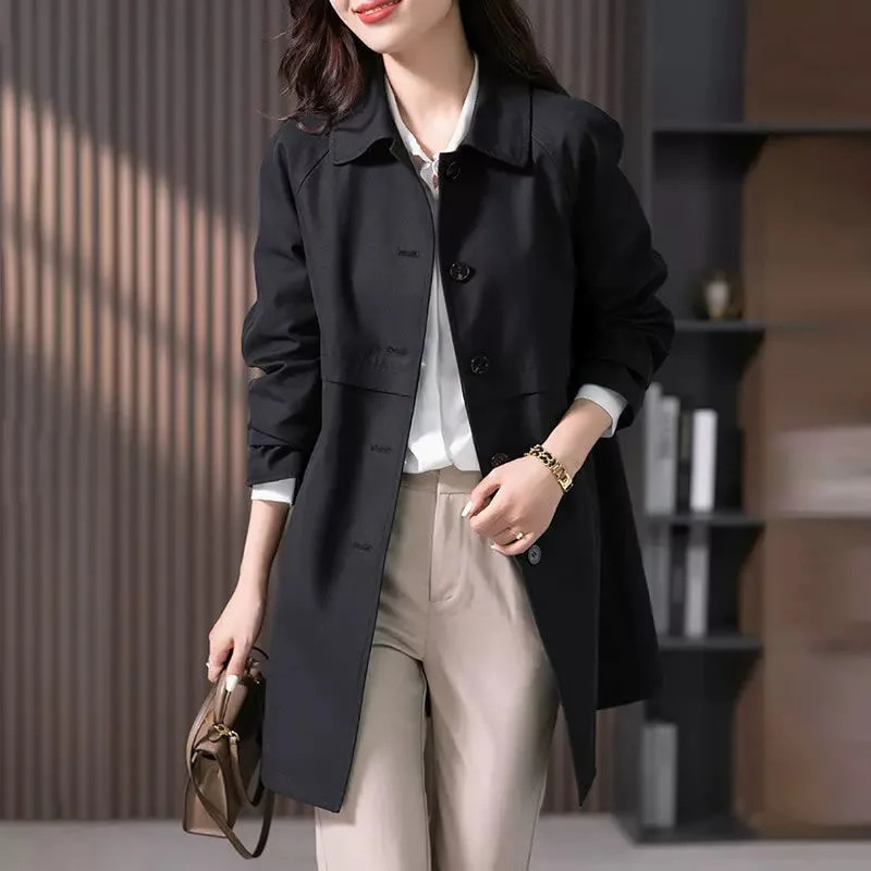 Women's stylish short trench coat with single-button closure, classic silhouette, sleek tailoring, ideal for various settings