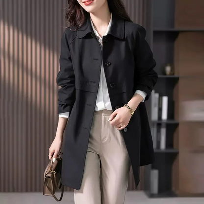 Women's stylish short trench coat with single-button closure, classic silhouette, sleek tailoring, ideal for various settings