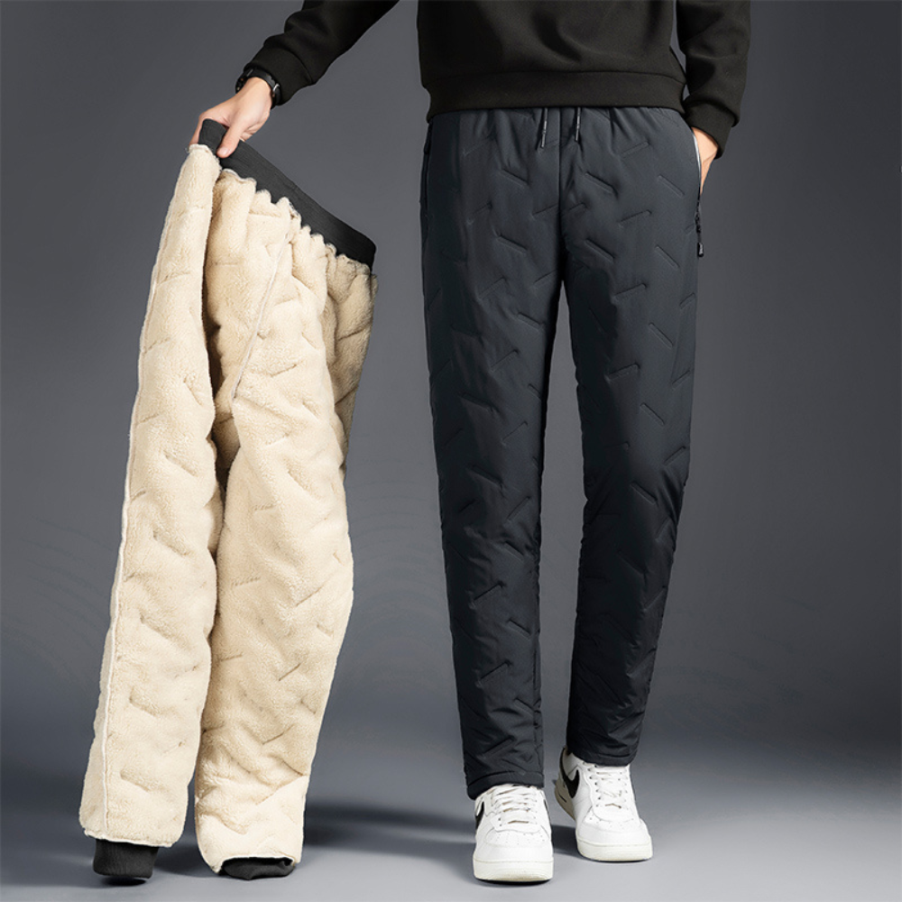 Women's thermal waterproof fleece-lined trousers, black, fleece interior, zippered pockets, ideal winter outdoor wear.