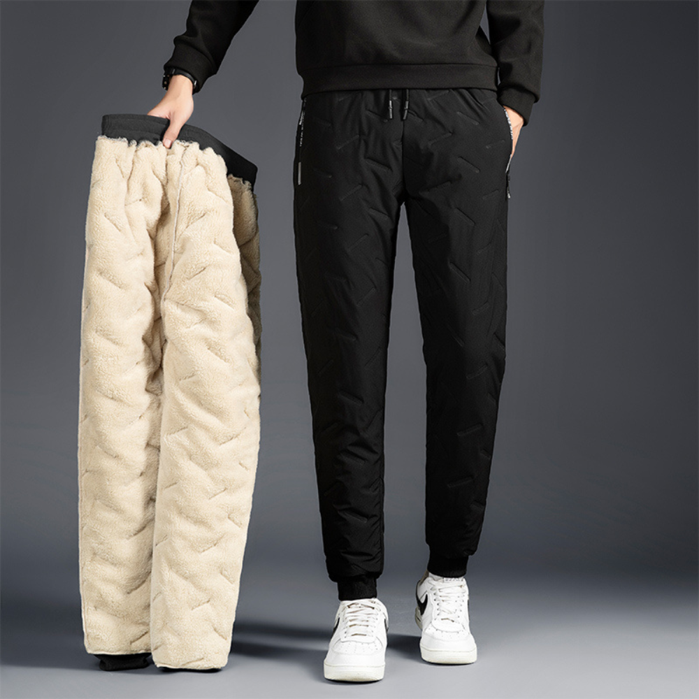 Women's thermal waterproof fleece-lined trousers, black, fleece interior, zippered pockets, ideal winter outdoor wear.