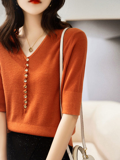 "Women's V-neck button knitted top with relaxed fit, shown in vibrant colors, offering style and comfort for any occasion."