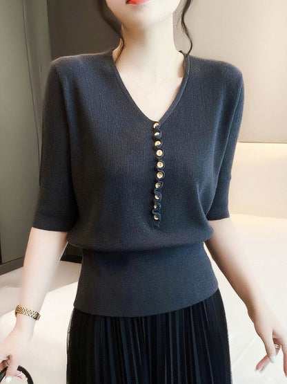 "Women's V-neck button knitted top with relaxed fit, shown in vibrant colors, offering style and comfort for any occasion."