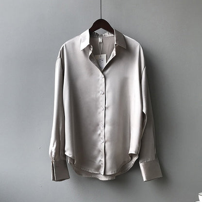 Women's vintage silk blouse with tailored fit, chic design, elegant silhouette, and luxurious lightweight fabric.