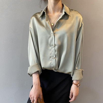 Women's vintage silk blouse with tailored fit, chic design, elegant silhouette, and luxurious lightweight fabric.