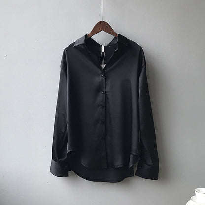 Women's vintage silk blouse with tailored fit, chic design, elegant silhouette, and luxurious lightweight fabric.