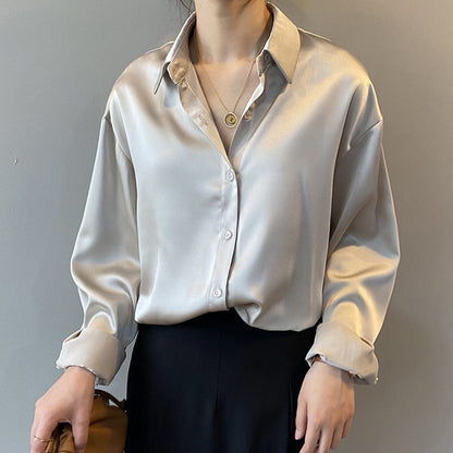 Women's vintage silk blouse with tailored fit, chic design, elegant silhouette, and luxurious lightweight fabric.