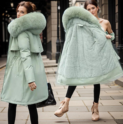 Women's warm waterproof winter coat, modern fit, sleek design, with hood and adjustable cuffs for wet conditions.