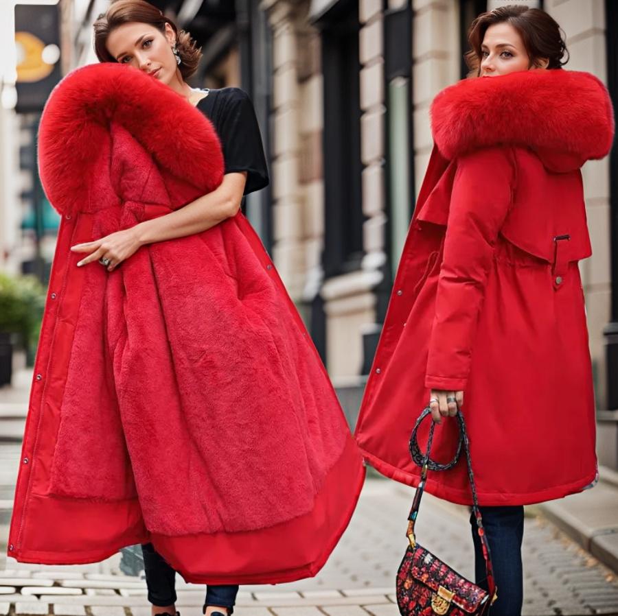 Women's warm waterproof winter coat, modern fit, sleek design, with hood and adjustable cuffs for wet conditions.