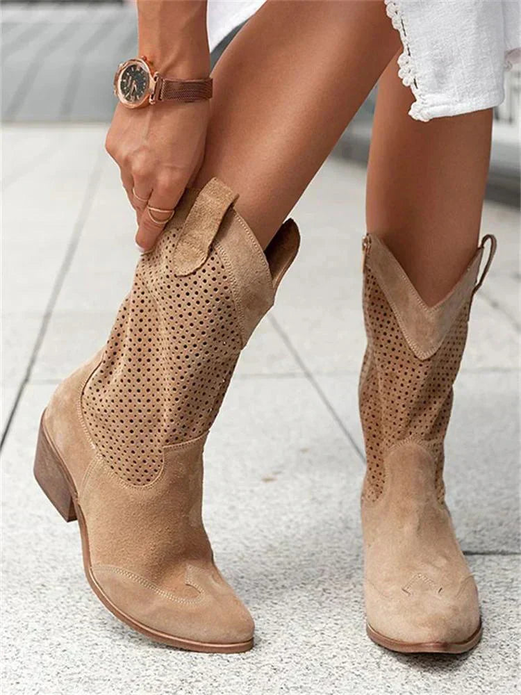 "Women's western ankle boots with pointed toe, block heel, faux leather finish, and pull-on tabs for easy wear."