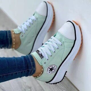 "Women's white chunky sole low-top sneakers, casual style with lace-up closure for modern comfort and versatile wear."